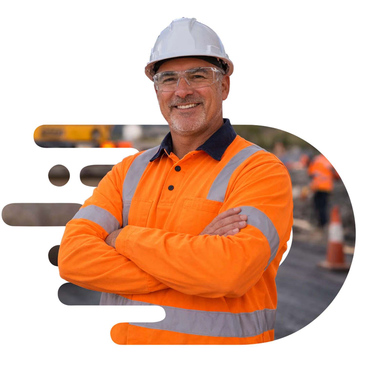 Older road construction worker wearing a white hard hat, safety glasses, and long-sleeve orange high-visibility shirt standing with arms crossed in front of a road roller on a roadworks site, smiling at the camera with the machinery softly blurred behind him.